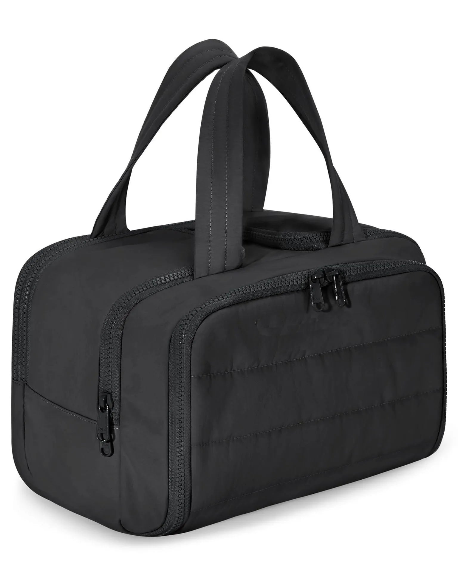 Large open-top travel toiletry bag in black polyester with fluffy texture, showing ample storage space.