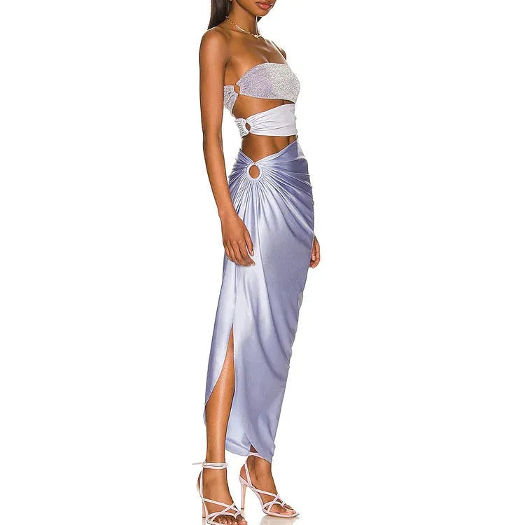Purple women's one-piece swimsuit with hollow design and matching wrap skirt.