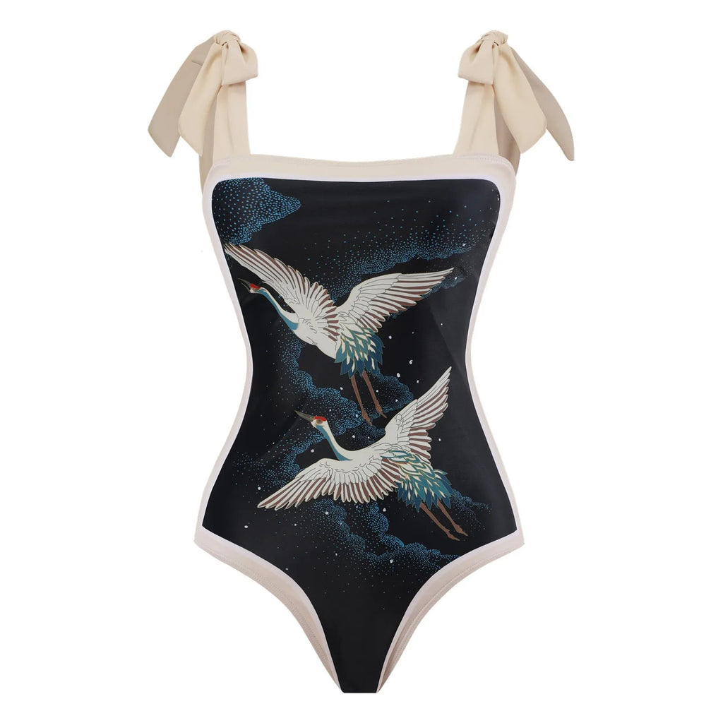Women's yellow one-piece swimsuit with floral pattern and matching white chiffon skirt.