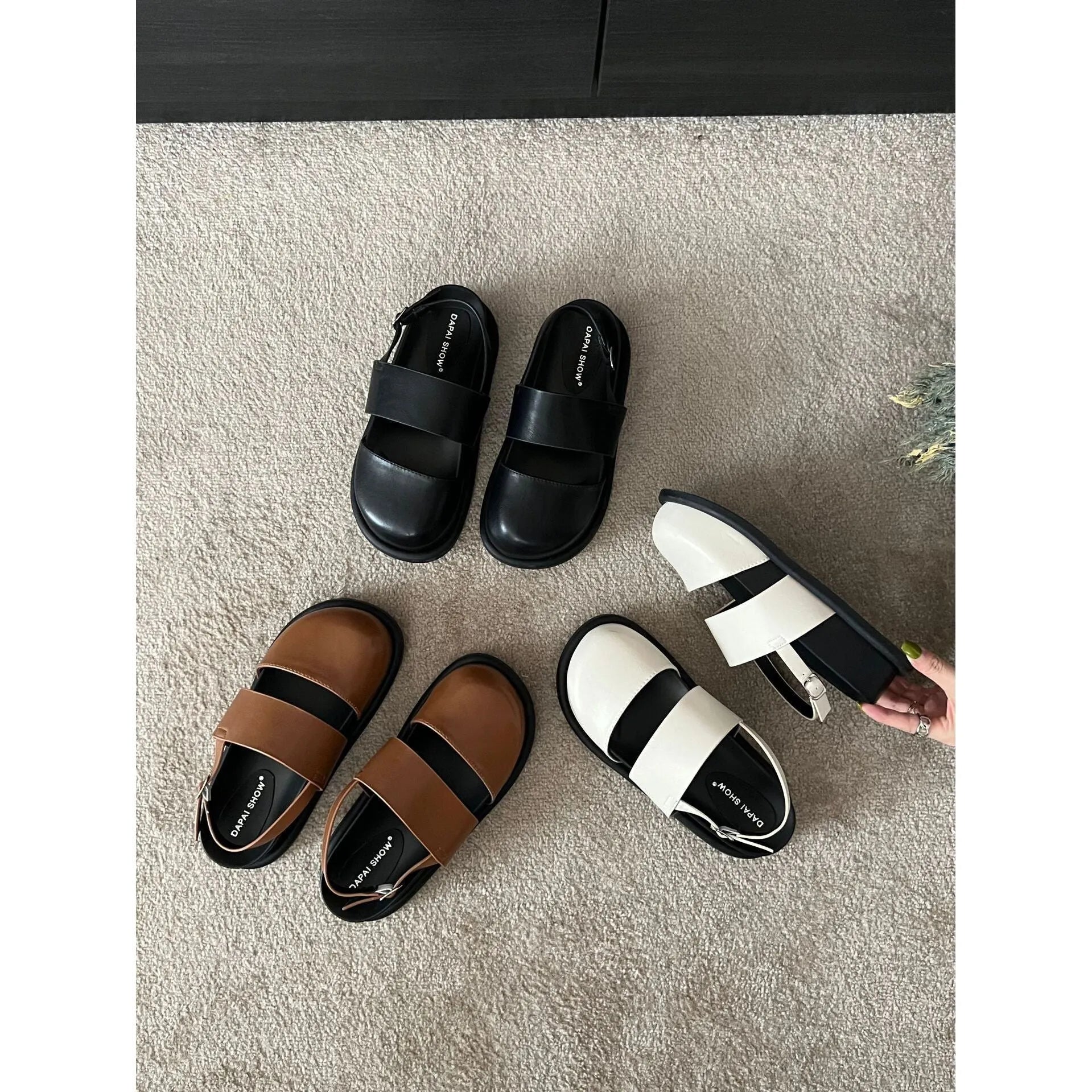 Retro style closed toe sandals with a single ankle buckle strap in apricot colour.