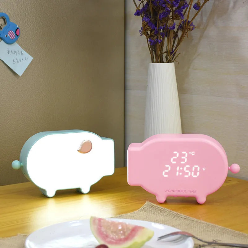 Multifunctional LED alarm clock with temperature display and USB charging port in blue or pink