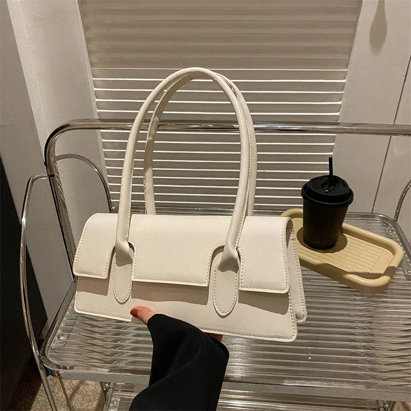 Women's small square shoulder bag in PU leather with horizontal rectangle shape and stitching detail
