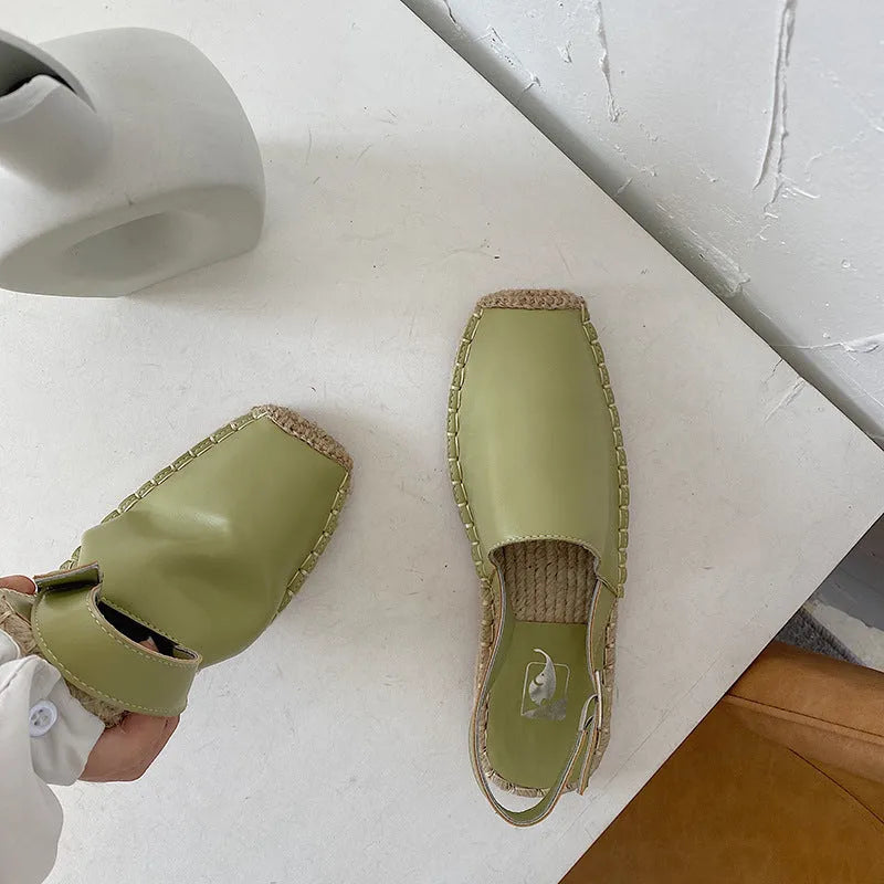 Women's beige retro fisherman flat sandals with canvas upper and animal pattern.