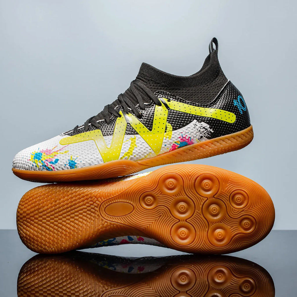 Low-cut black and yellow football boots with replaceable screw-in studs on rubber sole.