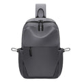 Men's grey waterproof chest bag with shoulder strap showing 33cm height dimensions