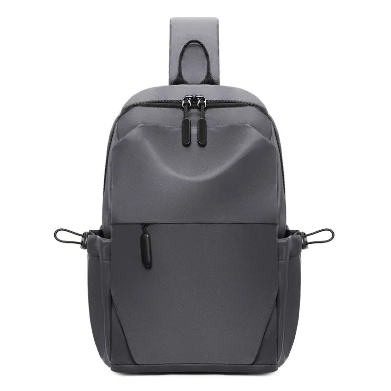 Men's grey waterproof chest bag with shoulder strap showing 33cm height dimensions