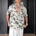 Floral printed short sleeve shirt in loose casual pendant style shown in white and black options