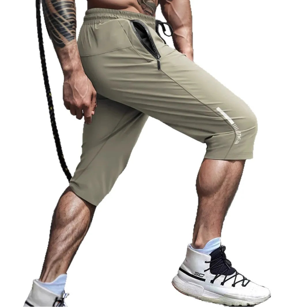 Men's cropped quick-dry sports casual pants in nylon, shown in blue colour.