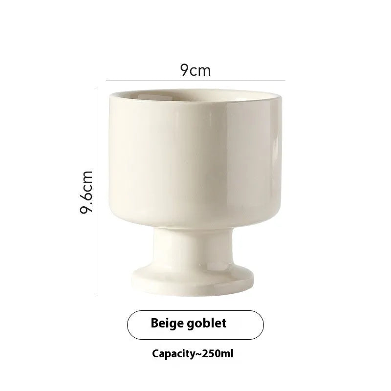 Hand-pinched irregular ceramic mug with modern minimalist design in solid colour