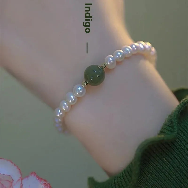 Handmade Chinese style glass bracelet with bamboo joint beads in a red Lvzhu Duobao design.