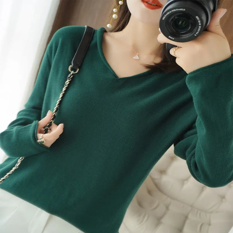 Women's V-neck long sleeve knitwear pullover top in a macaron colour on a hanger.