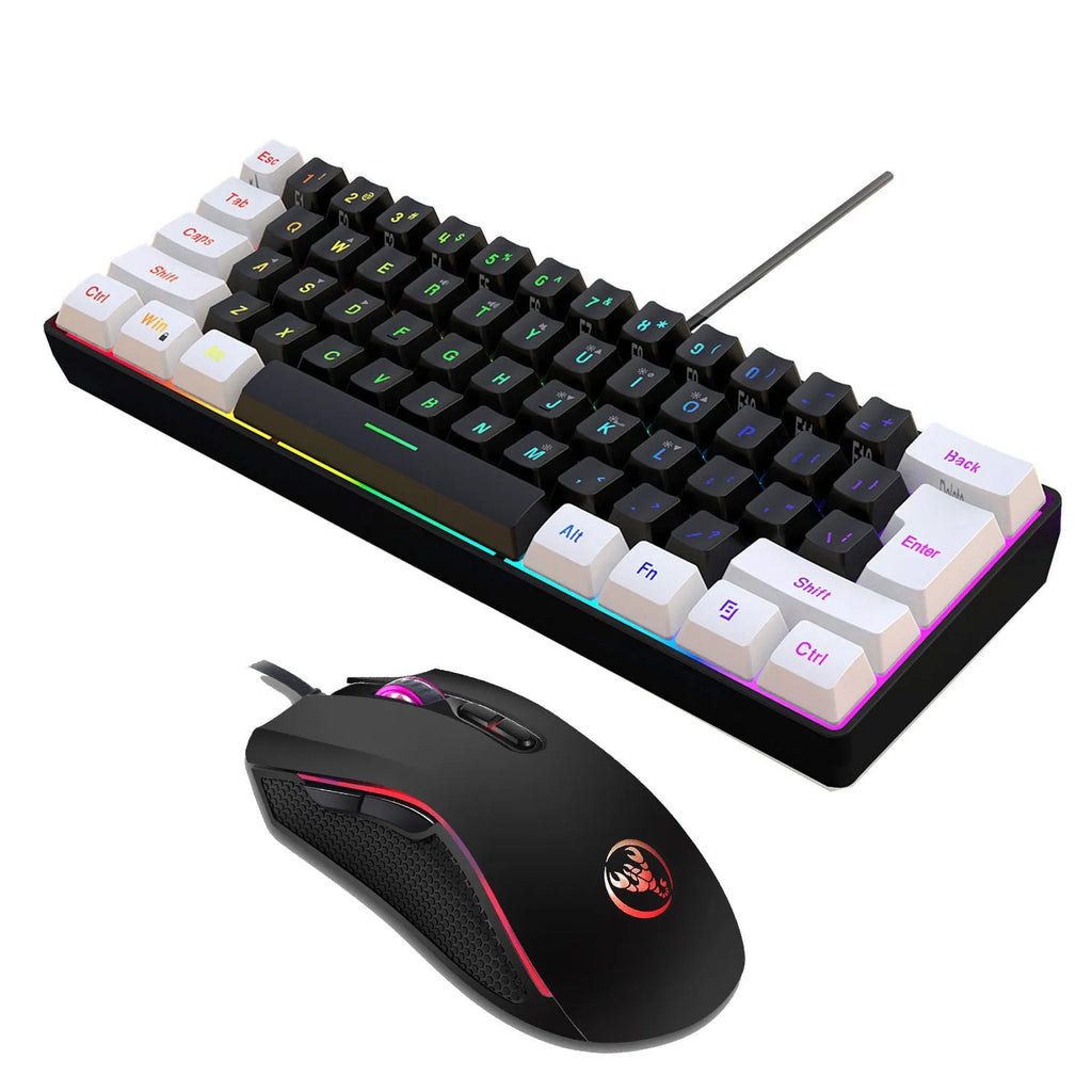 White and black gaming keyboard and mouse set with colour backlight on desk beside notebook computer