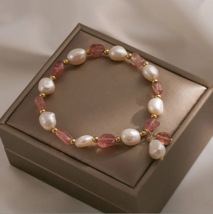 Handmade natural strawberry quartz crystal bracelet for women with moon and pearl bead designs.
