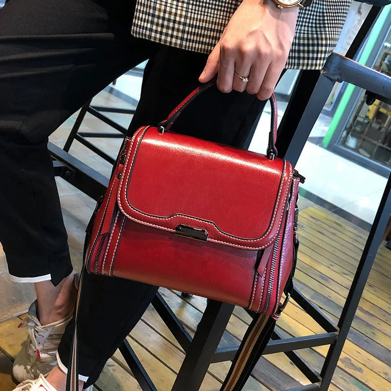 Genuine leather women's messenger bag in horizontal square shape with multiple pockets and double shoulder straps