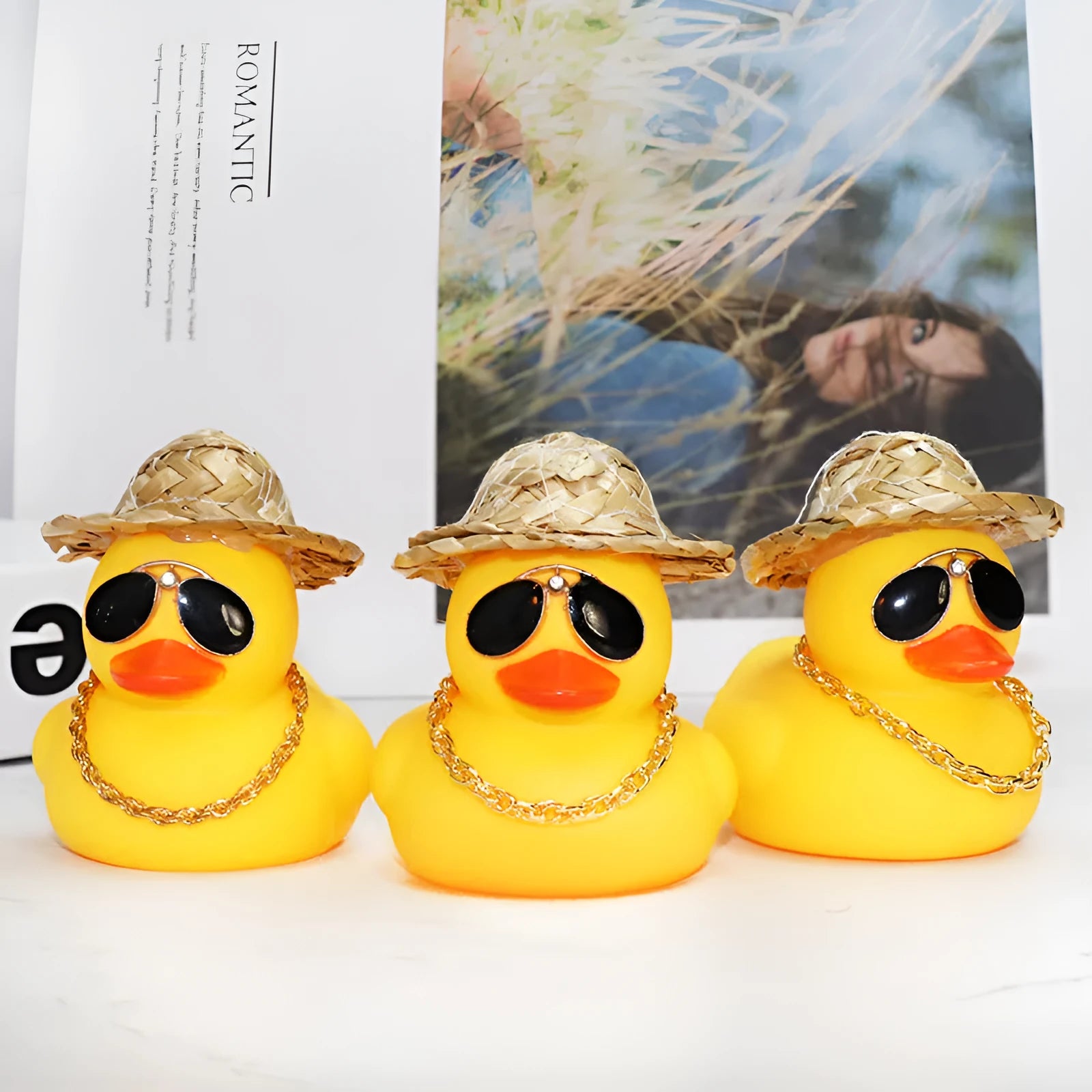 Yellow duck car dashboard ornament with straw hat, matte finish, and included adhesive base with sunglasses necklace