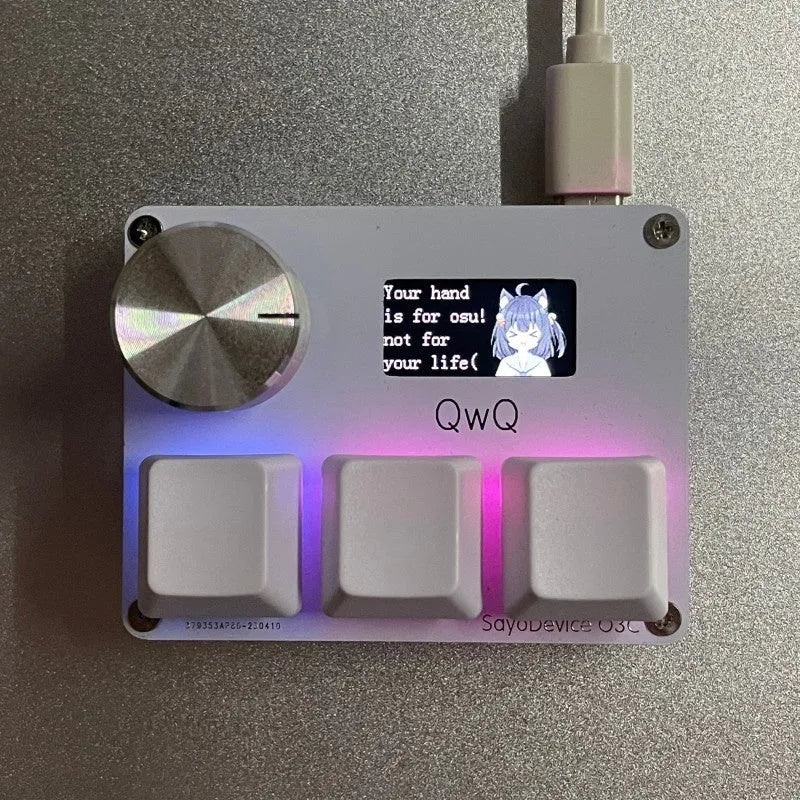 Customisable magnetic axis gaming numeric keypad with colour screen and control knob on desk