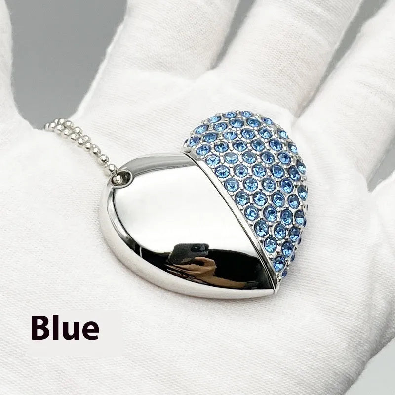 Blue heart-shaped metal USB flash drive with a brick pattern design on a white background.
