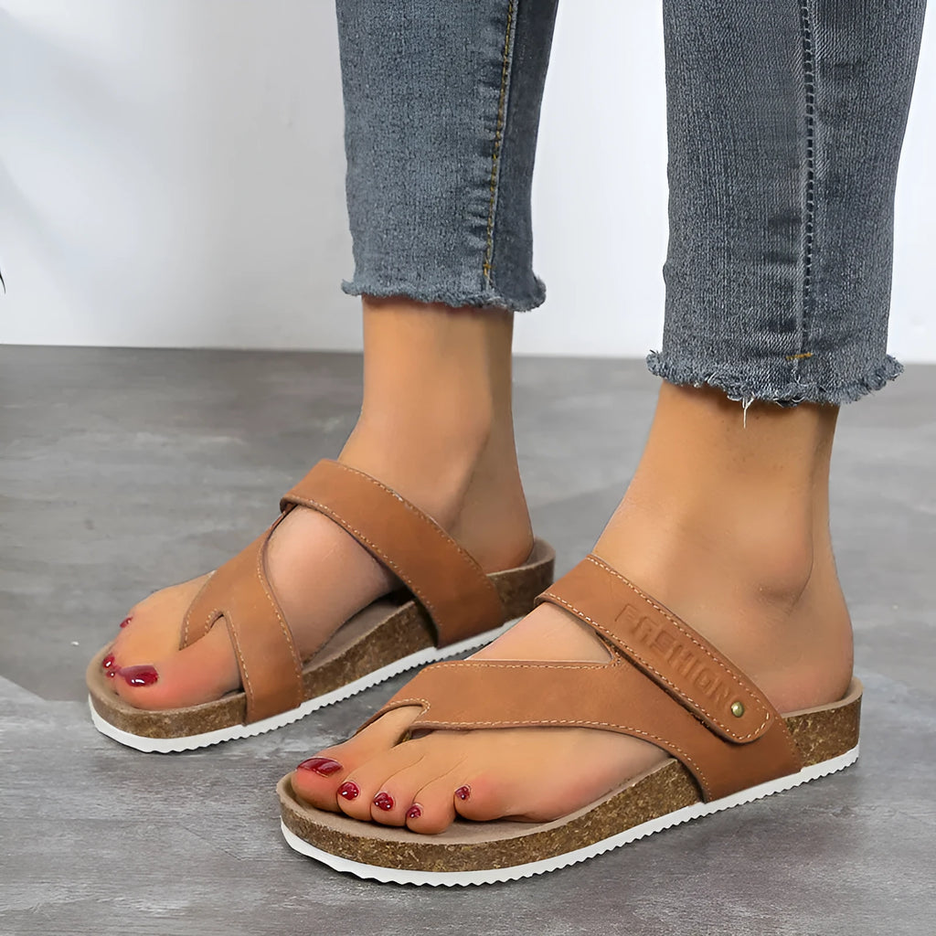 Women's flat toe ring flip-flop in a solid colour with a thick foam sole.