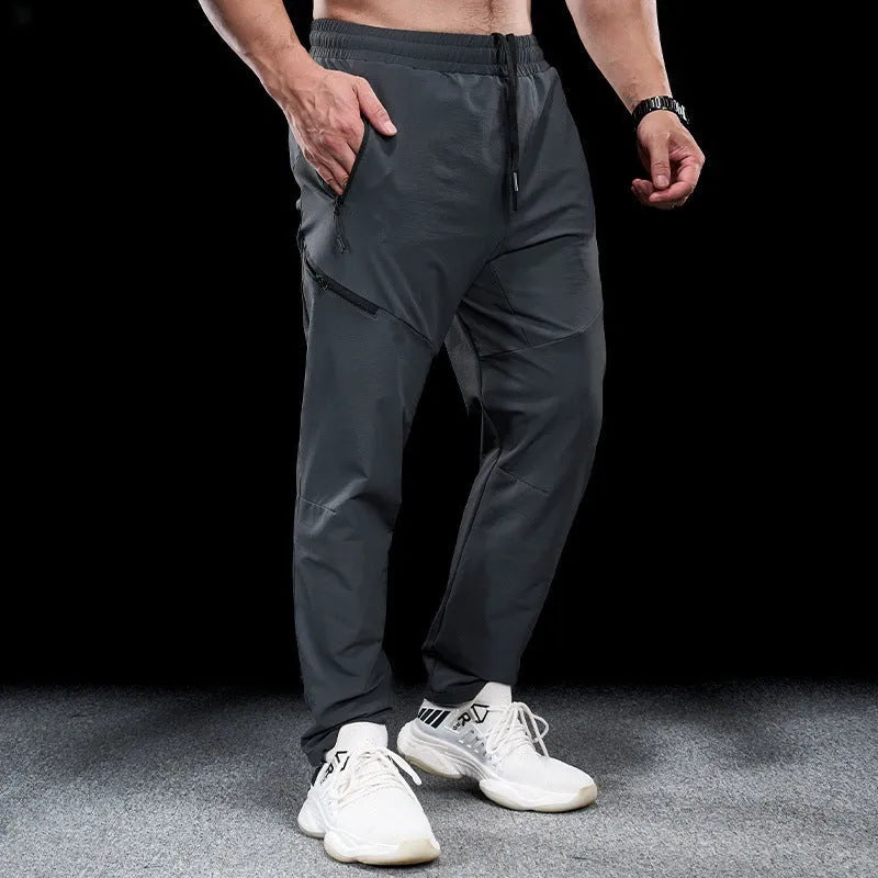 Men's black waterproof quick-drying nylon workout trousers for sports and exercise