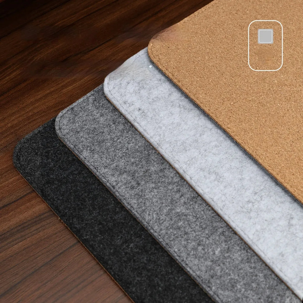 Oversized black grey felt and cork mouse mat on office desk with non-slip backing