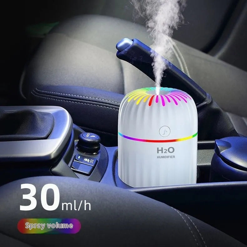 Small green animal-shaped USB aromatherapy humidifier with compact plastic build.