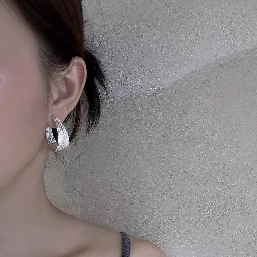 Copper geometric multi-layer bracelet earrings in silver or gold finish, available as clip-on or stud styles