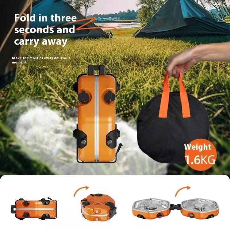 Orange portable double-headed butane camping gas stove folded and open on grass