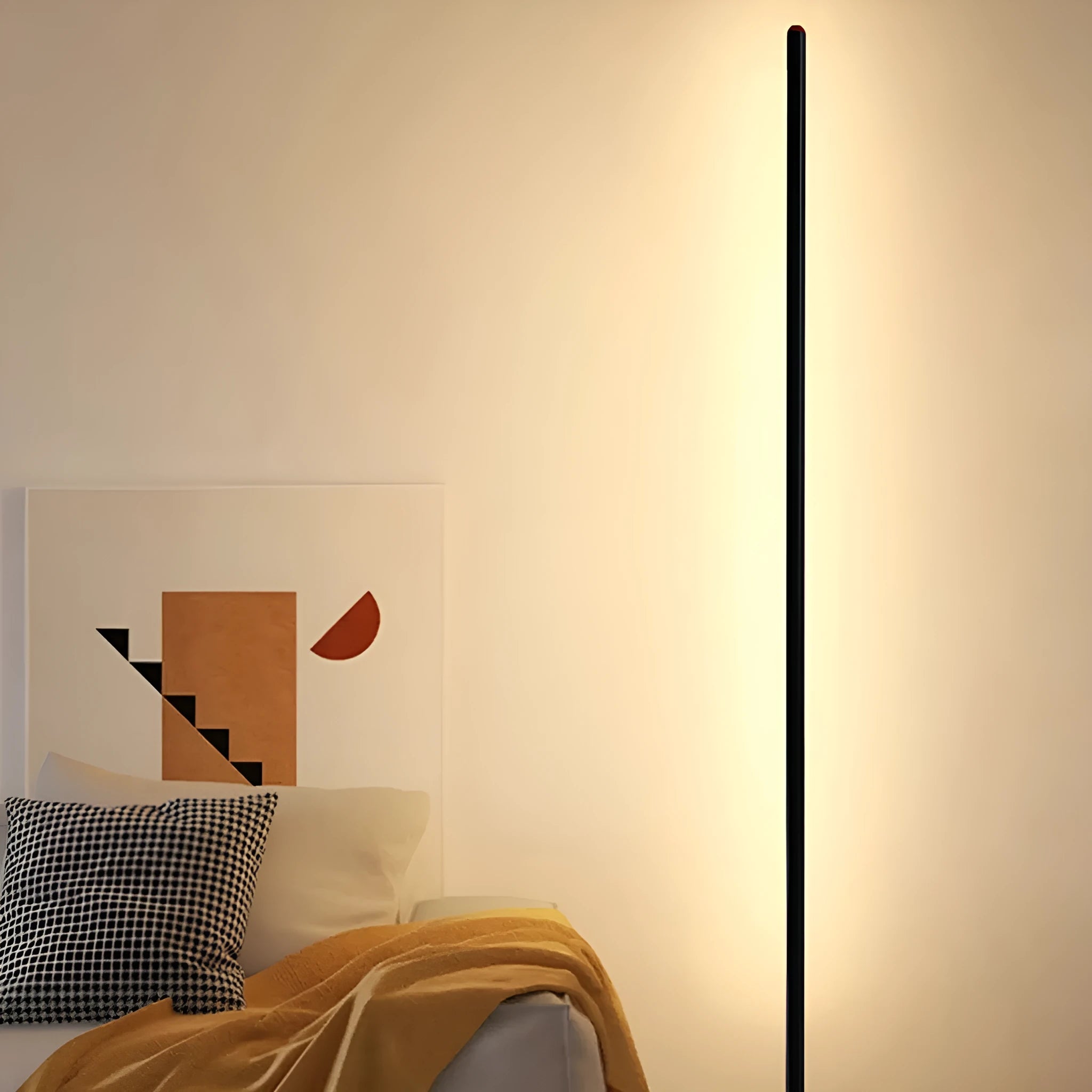 Modern simple vertical aluminium alloy floor lamp in silver, shown beside a sofa.