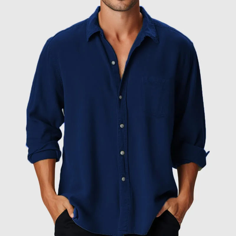 Man wearing a loose-fitting long sleeve beach shirt with a stand collar, available in various colours.