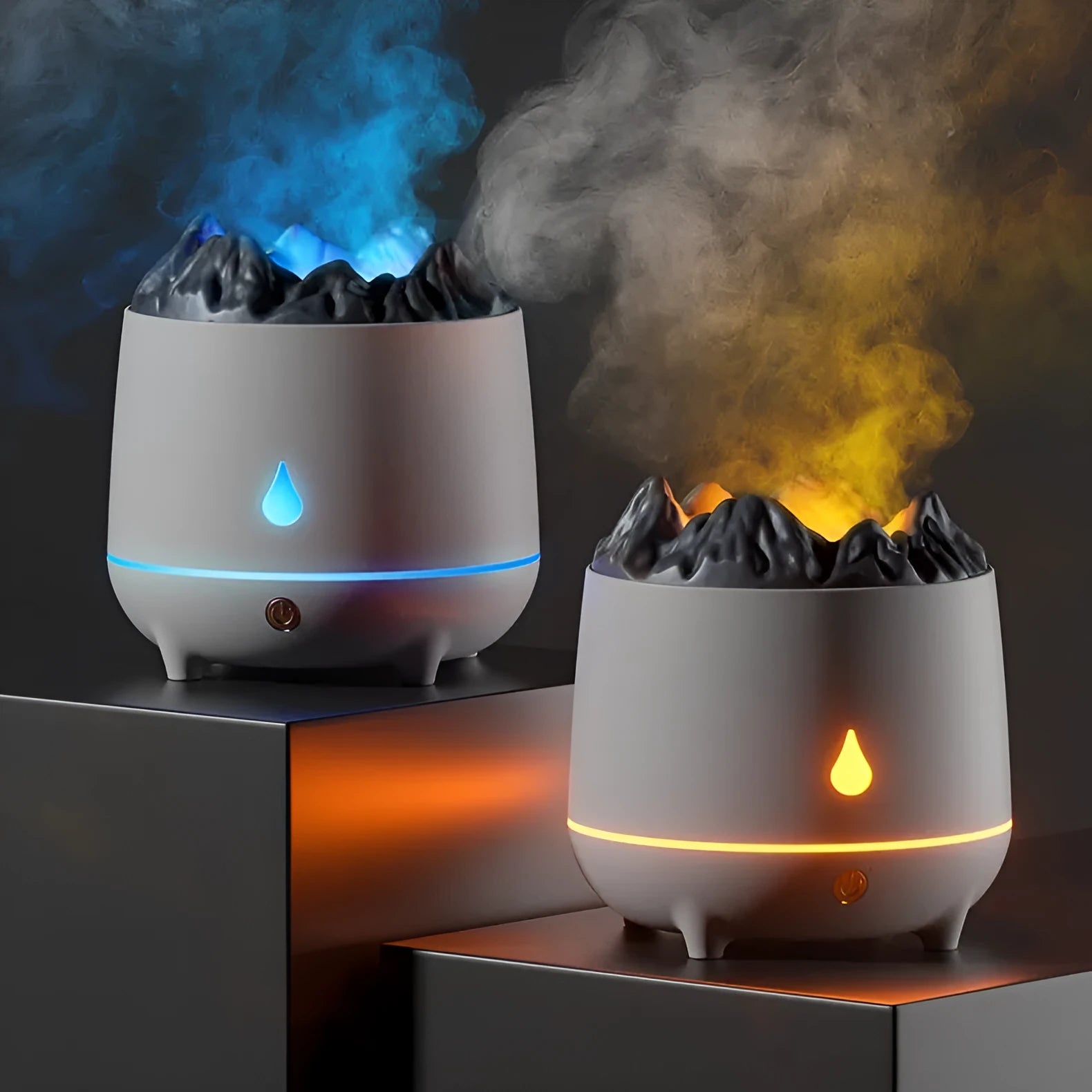 Black and white volcano-shaped ultrasonic humidifier with USB cable on a desk.