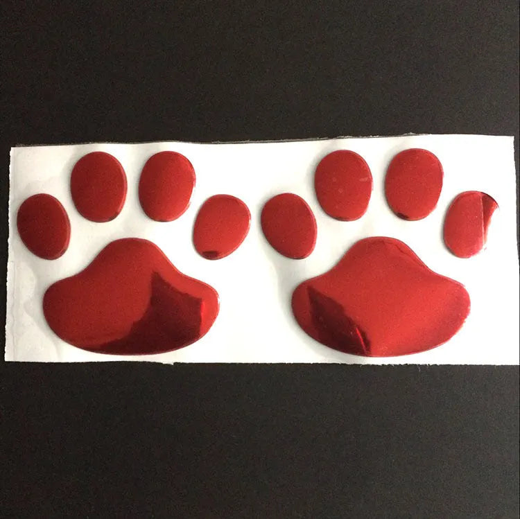 Pair of red dog footprint car stickers in a hand-shaped brush style on a white background.