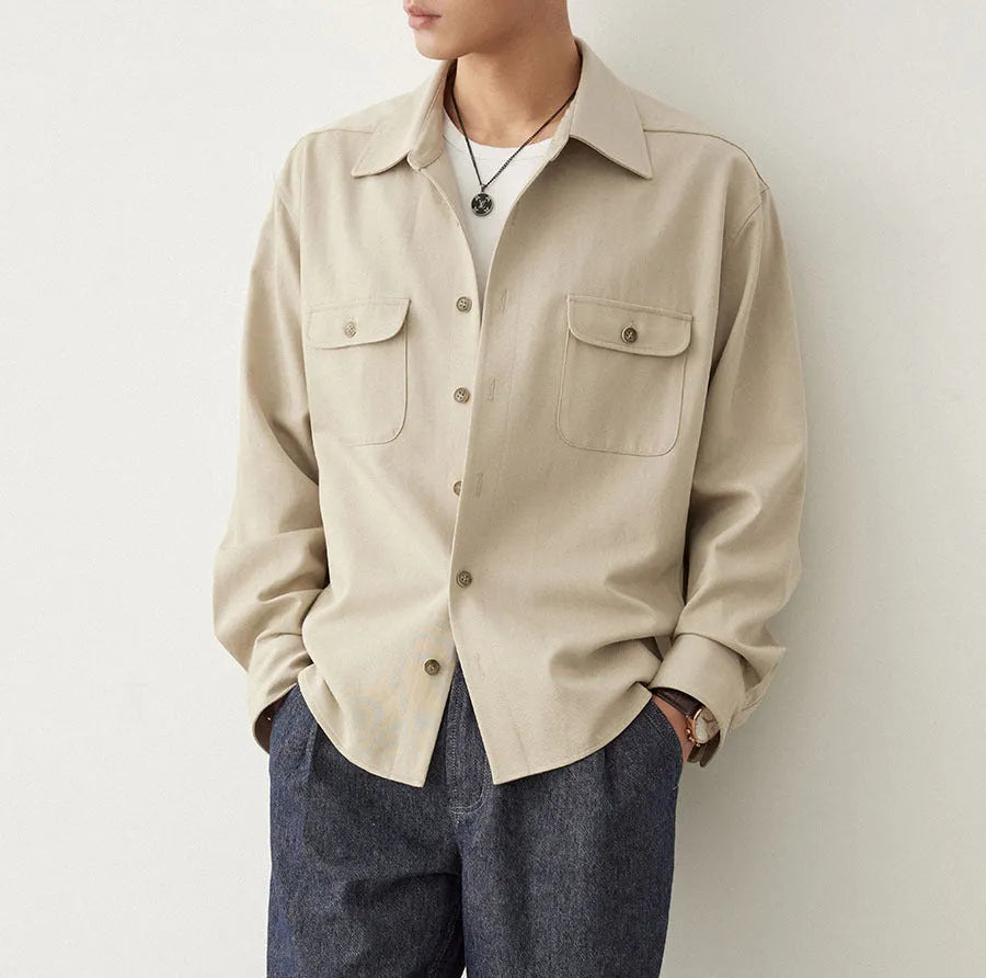 Men's light sand rice casual lapel collar long sleeve shirt on a hanger.