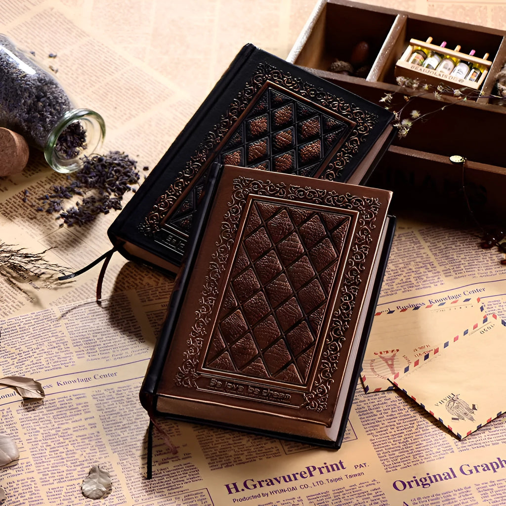 Embossed faux leather notebook with three-dimensional patterns in bronze or black gold colour