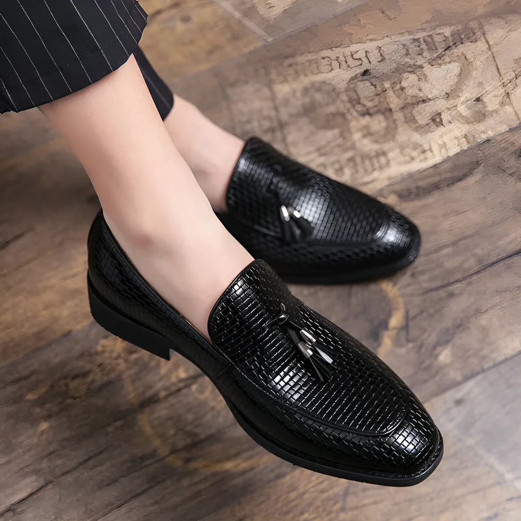 Men's black pointed toe slip on shoes with tassel detail on artificial PU upper