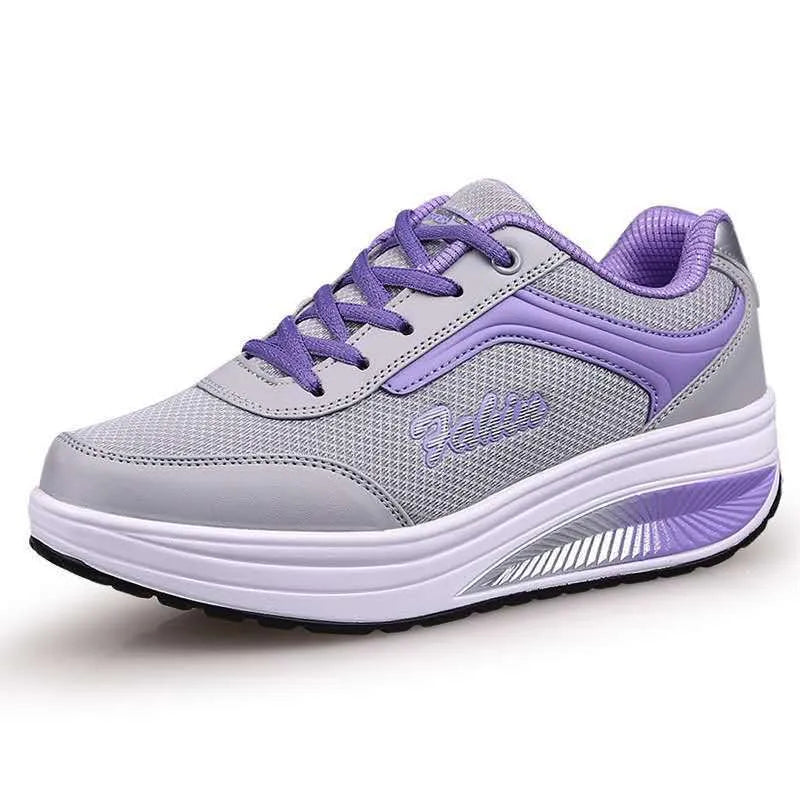Women's slip-on casual shoe in a mid-heel style, shown in one of the available colours.
