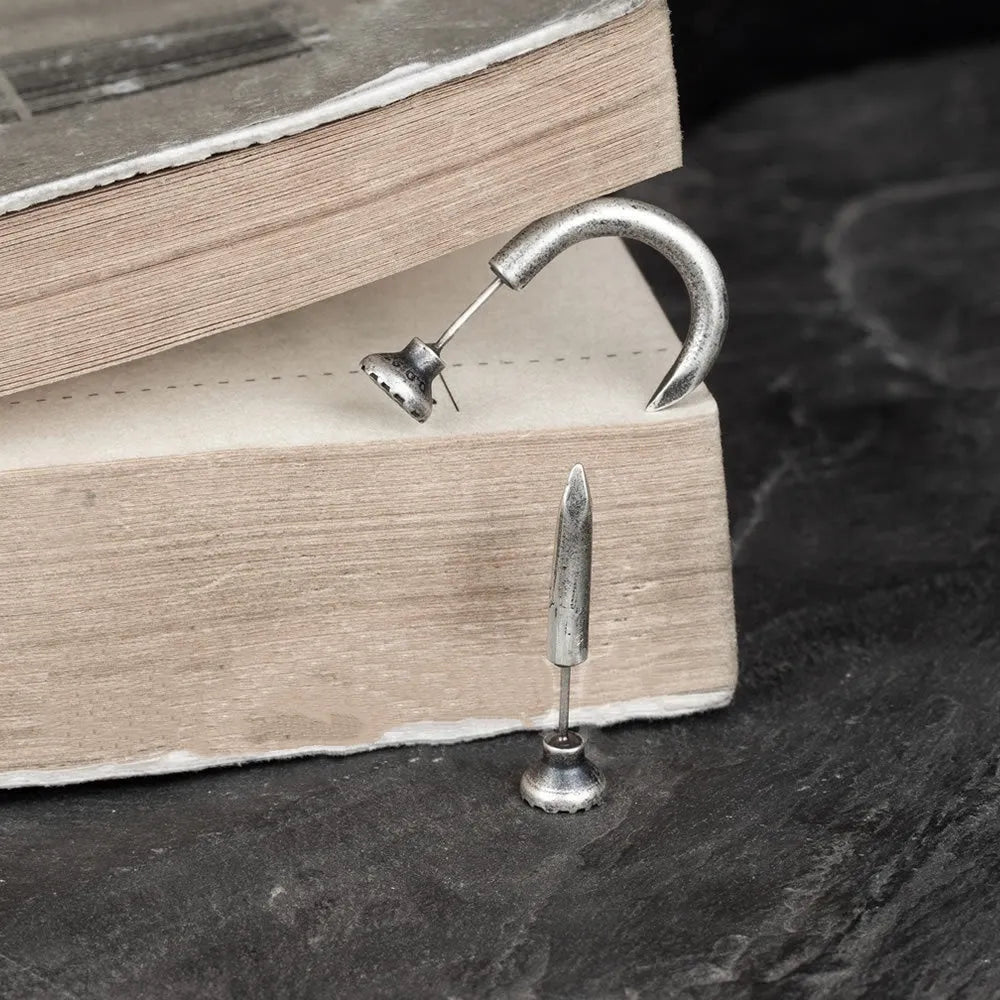 Sterling silver punk nail earrings with ear hook design showing straight and curved options