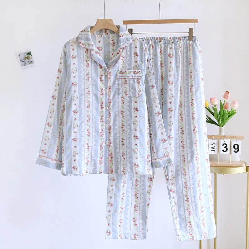 Ladies' red and white striped cotton gauze long-sleeved top and trousers loungewear set laid flat.