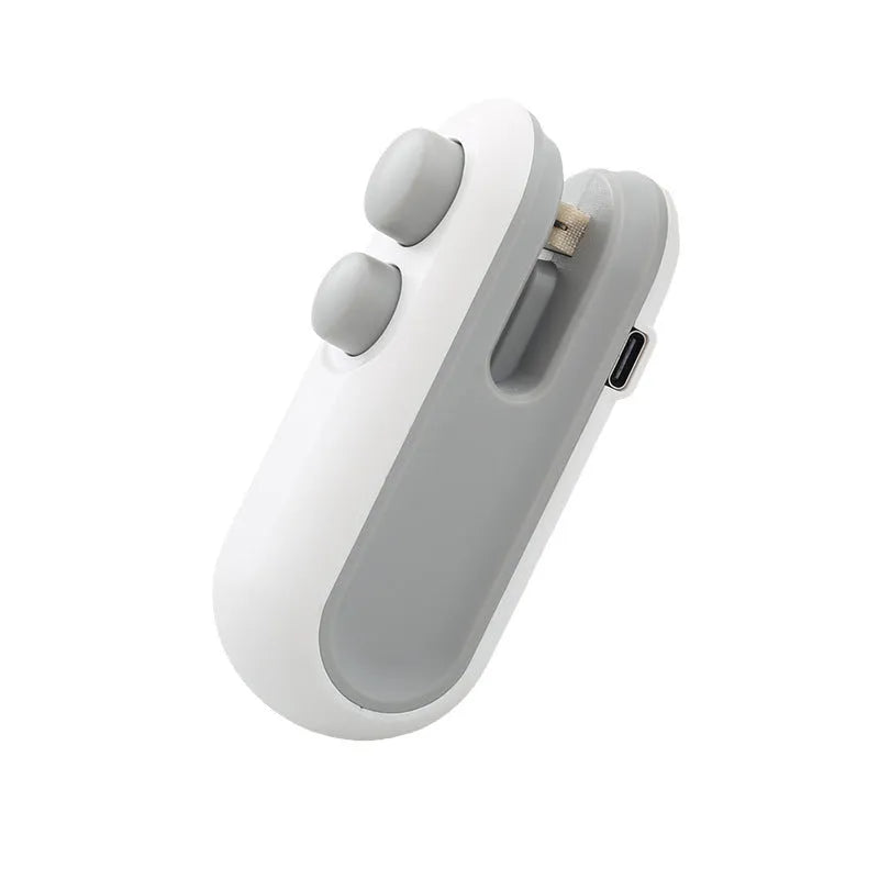 White handheld bag sealer with USB charging port and cutter blade for food storage