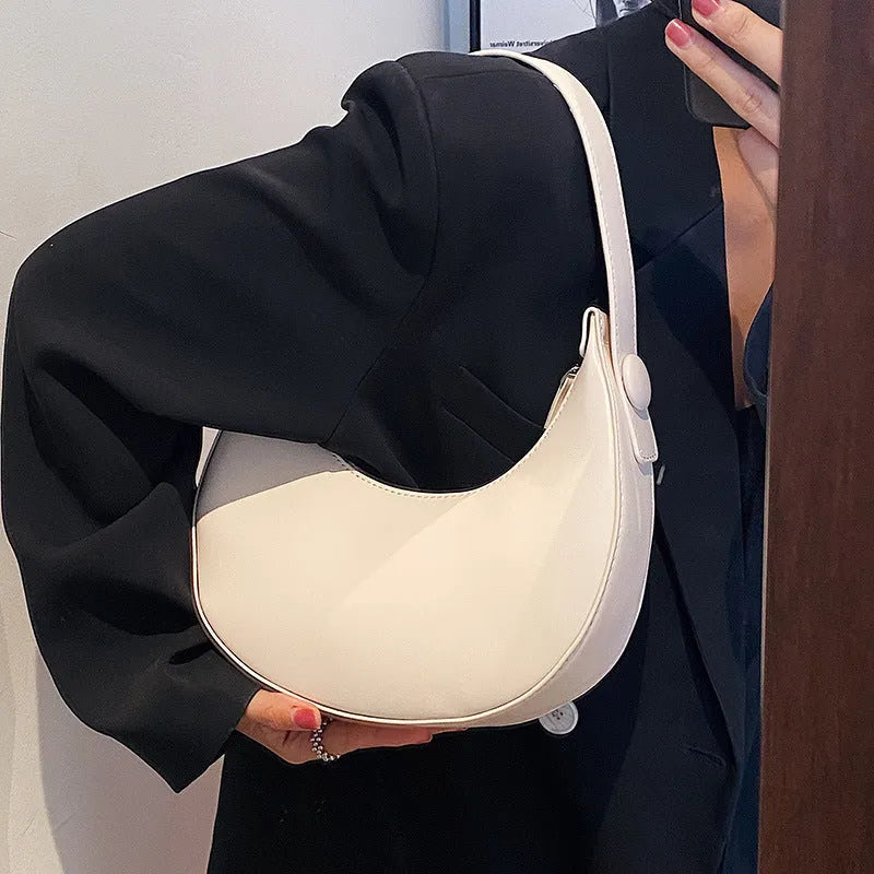 Women's cream yellow retro dumpling-shaped PU leather shoulder bag showing front and internal zippered pocket.