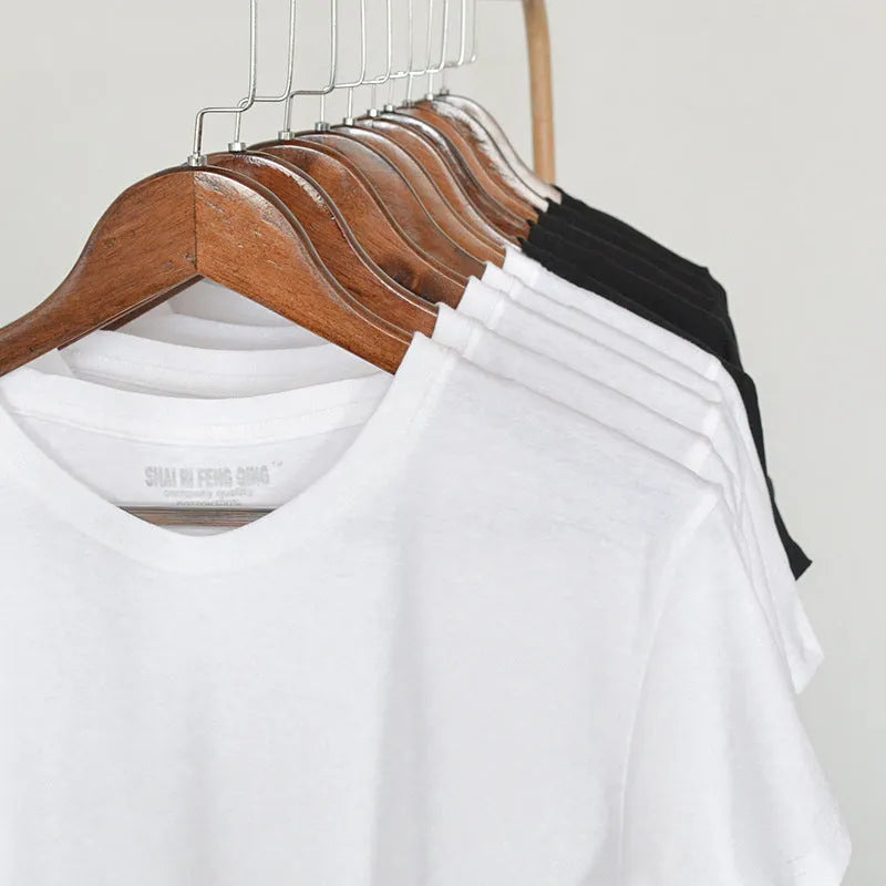 Men's solid colour cotton round neck t-shirt on hanger showing short sleeve design