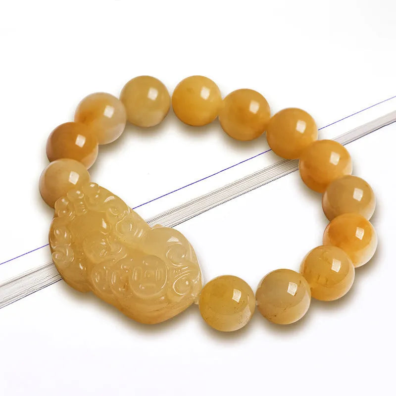Carved Golden Thread Jinsi Jade bracelet with money motif on adjustable cord, shown in two bead sizes.