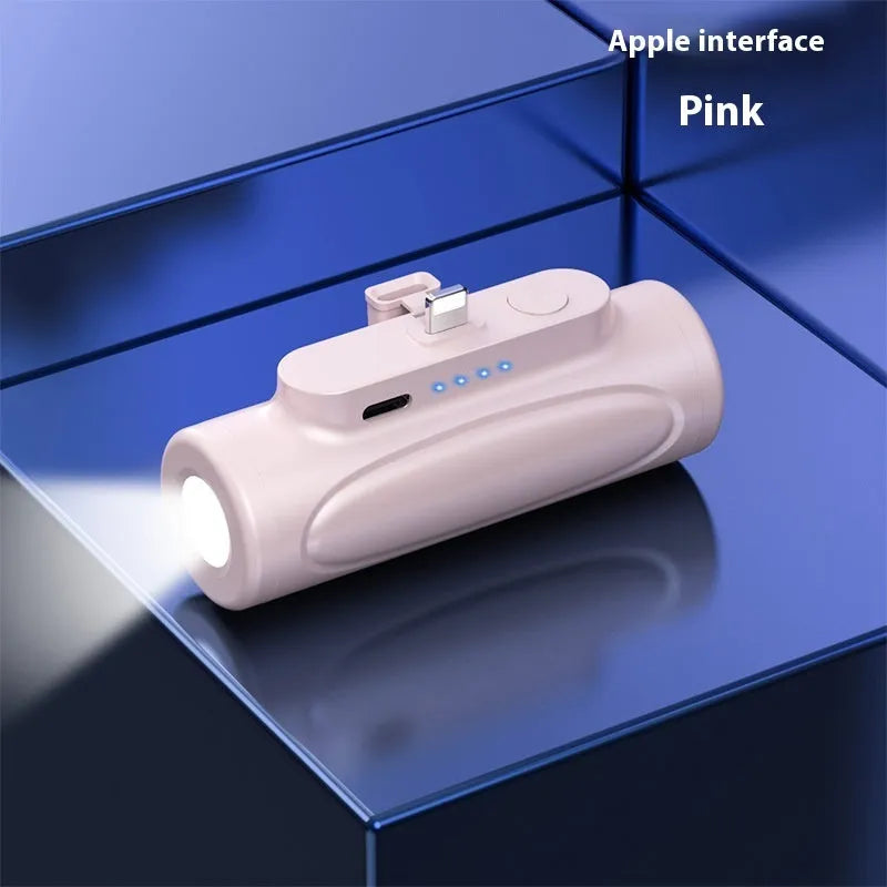 Black and pink creative power bank with integrated LED glare flashlight, showing Type-C and Apple port options.