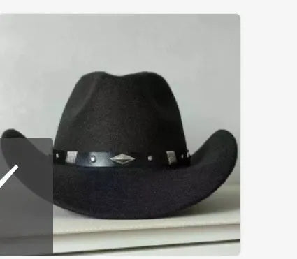Brown leather velvet western cowboy hat with a curved brim and conical crown on a neutral background.