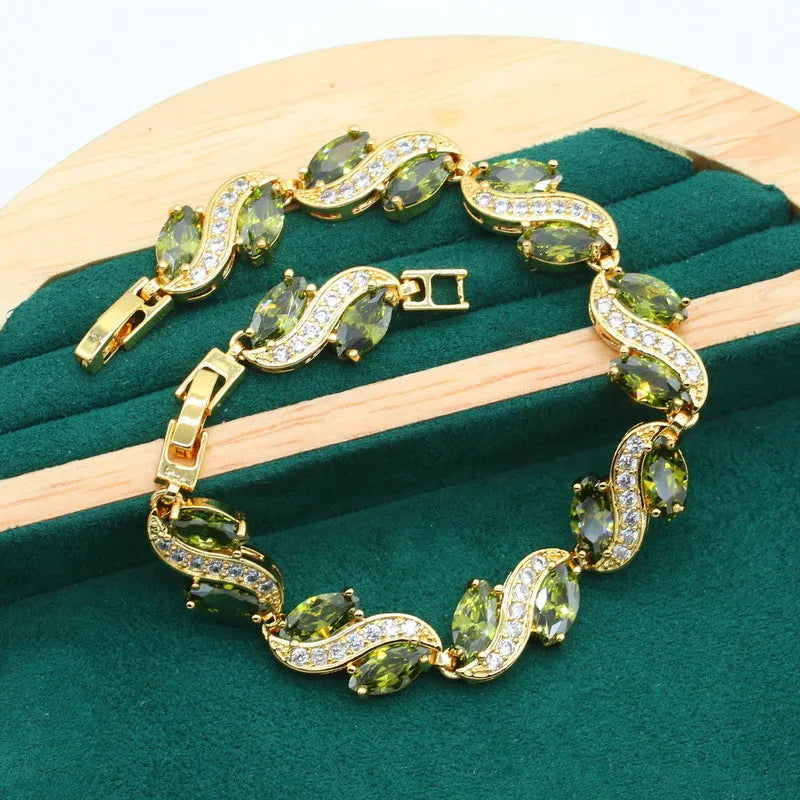Olive green anti-allergy AAA zircon jewellery set with necklace, ring, bracelet, and earrings on display
