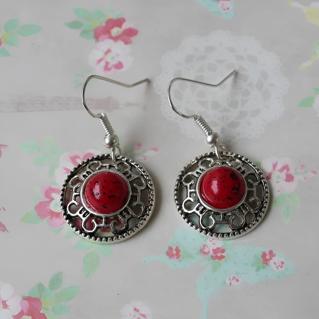 Miao silver earrings with turquoise geometric flower disk and totem patterns