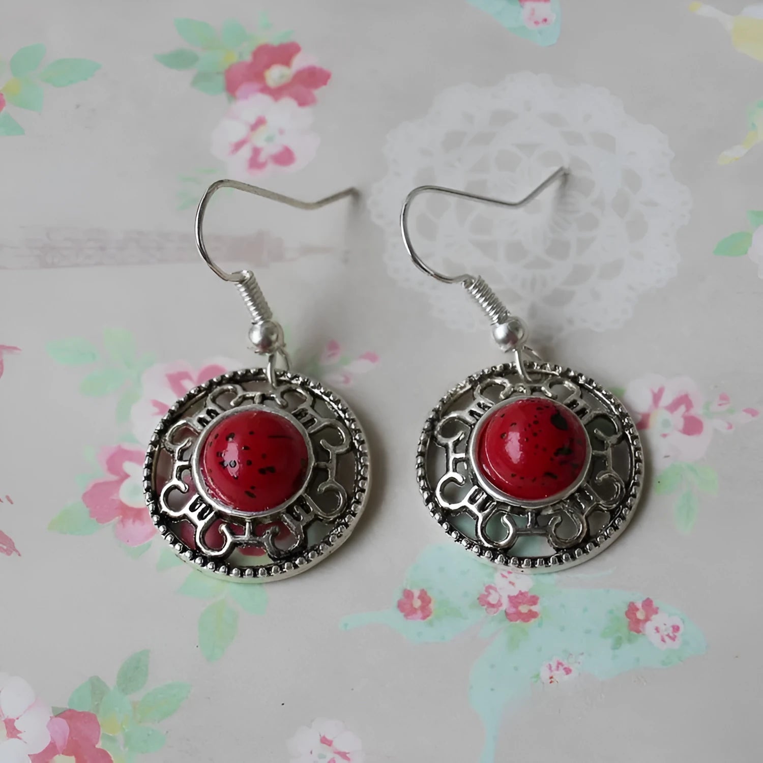 Miao silver earrings with turquoise geometric flower disk and totem patterns