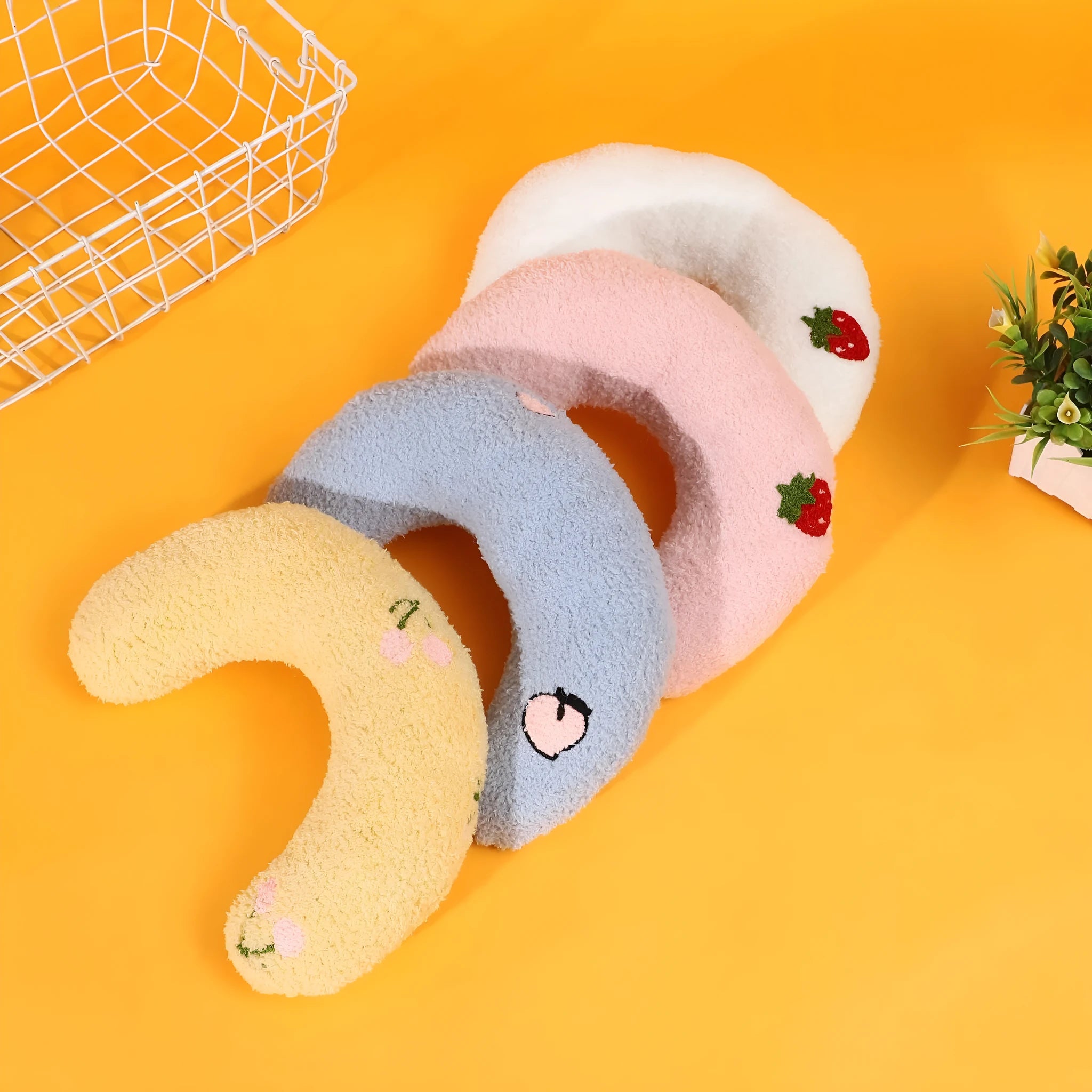Blue half moon U-shaped cat pillow with cartoon dog and cat design for pet crates.