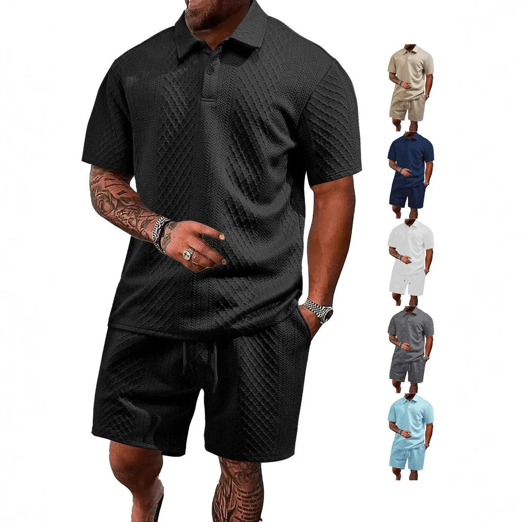 Men's patterned cloth casual suit set featuring a short sleeve polo shirt and trousers on a hanger.