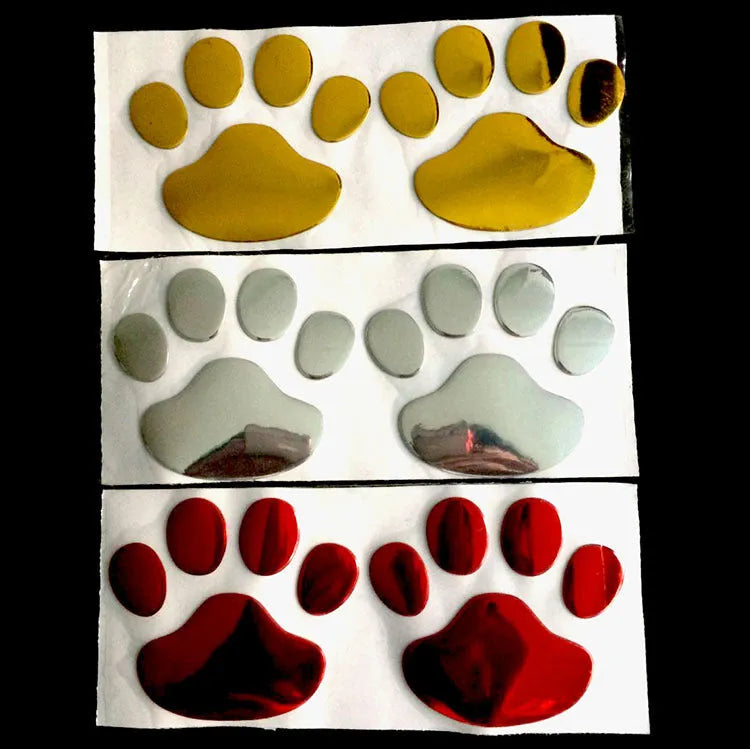 Pair of red dog footprint car stickers in a hand-shaped brush style on a white background.