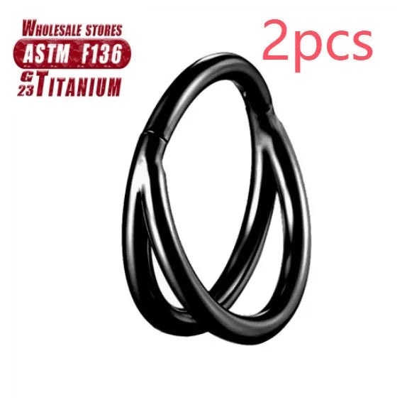 Titanium alloy nose ring on a plain background, shown in silver and gold finishes.